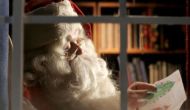 Santa Claus busy preparing for Christmas at Home